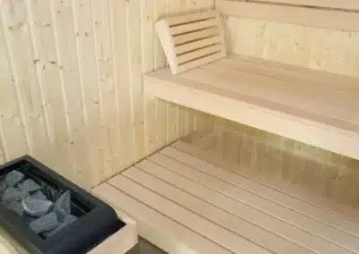 Sauna im Ferienhaus Tanne und Tal Relax mit Holzliegen und Saunaofen